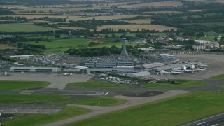 AX111_105 - 5.5K aerial stock footage of Edinburgh Airport and farmland, Scotland