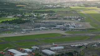 AX111_107 - 5.5K aerial stock footage of Edinburgh Airport runways and terminals, Scotland