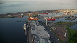 AX111_117E - 5.5K aerial stock footage approach ships at the Port of Edinburgh, Scotland