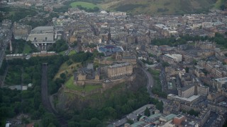AX111_139E - 5.5K aerial stock footage of orbiting historic Edinburgh Castle, Edinburgh