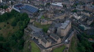 AX111_141 - 5.5K stock footage aerial video of flying by iconic Edinburgh Castle, Scotland