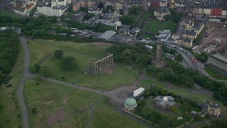 AX111_144E - 5.5K aerial stock footage of Calton Hill, including National Monument and the observatory, Edinburgh, Scotland