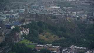 AX111_149E - 5.5K aerial stock footage of orbiting historic Edinburgh Castle on a hilltop, Scotland