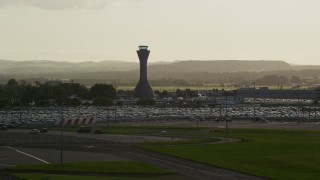 AX111_170 - 5.5K aerial stock footage of the control tower at Edinburgh Airport, Scotland