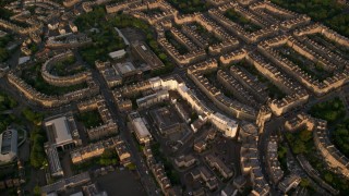AX112_012 - 5.5K aerial stock footage of row houses in Edinburgh, Scotland at sunset