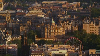 AX112_038E - 5.5K aerial stock footage of Lloyds Bank Headquarters office building in Edinburgh, Scotland at sunset