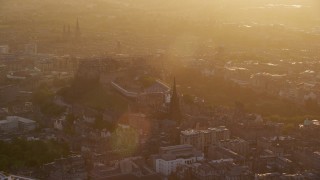 AX112_046 - 5.5K aerial stock footage of Edinburgh Castle and The Hub at sunset, Scotland