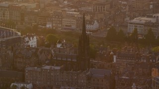 AX112_047 - 5.5K aerial stock footage of The Hub cathedral in Edinburgh, Scotland at sunset