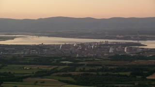 AX112_140 - 5.5K aerial stock footage of a natural gas power plant, Falkirk, Scotland at sunset