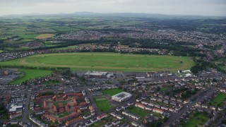 AX113_037E - 5.5K aerial stock footage of an orbit of the Ayr Racecourse, Scotland