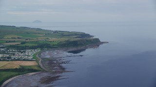 AX113_042 - 5.5K aerial stock footage approach coastal cliffs on Firth of Clyde, Ayr, Scotland