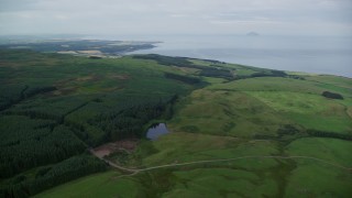 AX113_048E - 5.5K aerial stock footage of moorland and Drumshang Loch, Ayr, Scotland