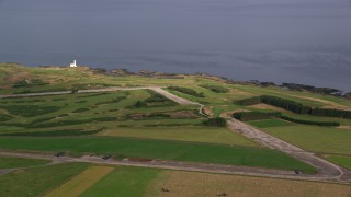 AX113_060 - 5.5K aerial stock footage of Turnberry Golf Course along Firth of Clyde, Scotland