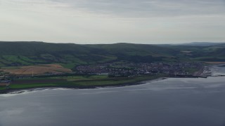 AX113_067E - 5.5K aerial stock footage of the coastal town of Girvan by the Firth of Clyde, Scotland