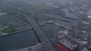AX113_088E - 5.5K aerial stock footage of bridges and office buildings along River Lagan, Belfast, Northern Ireland