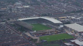 AX113_096 - 5.5K aerial stock footage of orbiting Windsor Park soccer stadium, Belfast, Northern Ireland