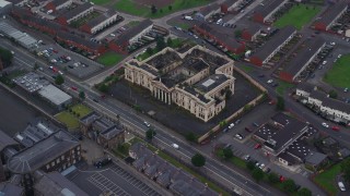 AX113_111 - 5.5K aerial stock footage of orbiting an abandoned courthouse, Belfast, Northern Ireland