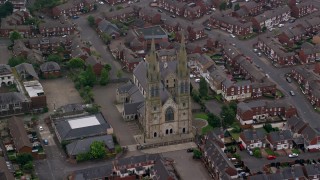 AX113_114 - 5.5K aerial stock footage of flying by St Peter's Cathedral, Belfast, Northern Ireland