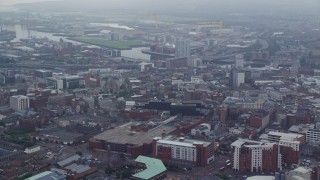 AX113_115E - 5.5K aerial stock footage approach River Lagan and M3 Bridge from cityscape, Belfast Northern Ireland