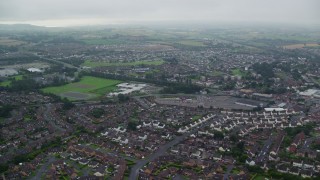 AX113_127E - 5.5K aerial stock footage of residential neighborhoods and countryside, Belfast, Northern Ireland