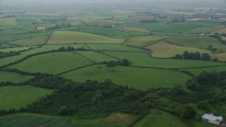 AX113_133E - 5.5K aerial stock footage of green fields and farms, Newtownards, Northern Ireland