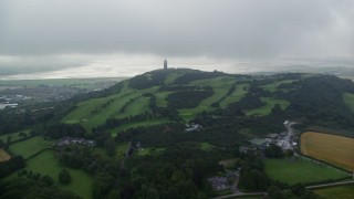 AX113_135E - 5.5K aerial stock footage approach Scrabo Tower atop a hill, Newtownards, Northern Ireland