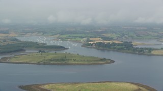 AX113_145E - 5.5K aerial stock footage of passing islands and a harbor in Strangford Lough, Northern Ireland