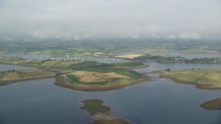 AX113_148E - 5.5K aerial stock footage flyby islands and a harbor in Strangford Lough, Northern Ireland
