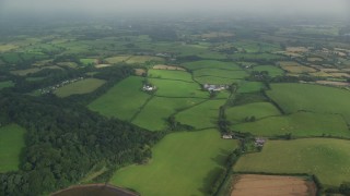 AX113_156 - 5.5K aerial stock footage of a vast rural landscape of farm fields, Killyleagh, Northern Ireland