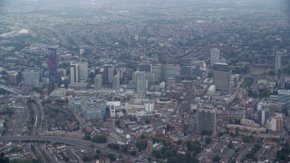 AX114_008E - 5.5K aerial stock footage of flying past the Centrale shopping mall and office buildings, Croydon, England