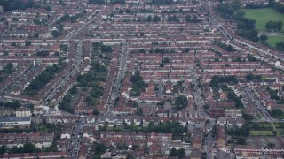 AX114_011E - 5.5K aerial stock footage row houses in Thornton Heath, England