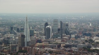 AX114_019 - 5.5K aerial stock footage approach The Shard Central and skyscrapers in Central London, England