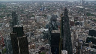AX114_026 - 5.5K aerial stock footage orbit tall skyscraper to reveal The Gherkin, Central London, England