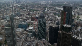 AX114_027 - 5.5K aerial stock footage orbiting The Gherkin and neighboring skyscrapers, Central London, England