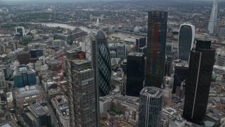 AX114_028 - 5.5K aerial stock footage of orbiting The Gherkin and Heron Tower skyscrapers, Central London, England