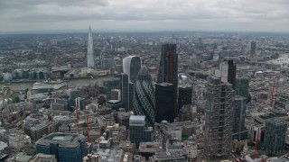 AX114_030 - 5.5K aerial stock footage of The Gherkin and nearby skyscrapers, The Shard in the distance, Central London, England
