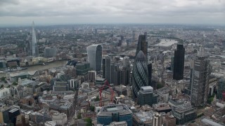 AX114_031 - 5.5K aerial stock footage of an orbit of skyscrapers, The Shard in the distance, Central London, England