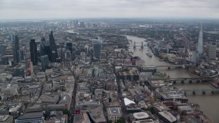 AX114_041E - 5.5K aerial stock footage of Central London skyscrapers and Tower Bridge near The Shard, England