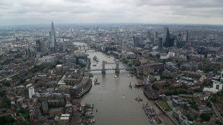 AX114_053 - 5.5K aerial stock footage of Central London city sprawl and Tower Bridge over River Thames, England