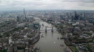 AX114_054 - 5.5K stock footage aerial video of the Shard and Tower Bridge over River Thames, Central London England