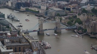 AX114_055 - 5.5K aerial stock footage of Tower Bridge over River Thames near Tower of London, Central London, England