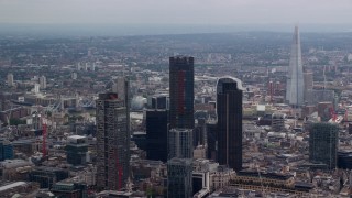 AX114_067E - 5.5K aerial stock footage flyby skyscrapers revealing The Shard, Central London, England