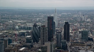AX114_068 - 5.5K aerial stock footage of towering skyscrapers and city sprawl, Central London, England