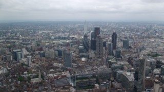 AX114_070E - 5.5K aerial stock footage of approaching The Gherkin skyscraper in Central London, England