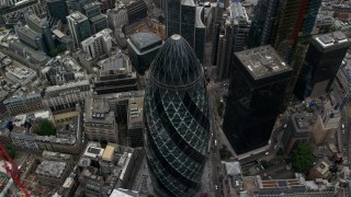 AX114_074 - 5.5K stock footage aerial video of tilting to a bird's eye view of The Gherkin skyscraper, Central London, England