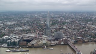 AX114_075E - 5.5K aerial stock footage of tilt to bird's eye of The Shard skyscraper in  London, England