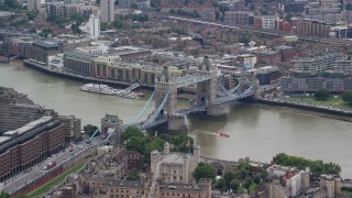 AX114_086 - 5.5K aerial stock footage of orbiting Tower Bridge and Tower of London, England