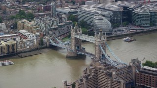AX114_091E - 5.5K aerial stock footage of orbiting the side of the Tower Bridge on River Thames in London, England