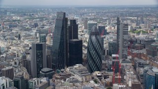 AX114_104E - 5.5K aerial stock footage of orbiting The Gherkin and Heron Tower skyscrapers, Central London, England