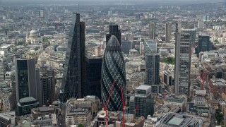 AX114_105 - 5.5K aerial stock footage of an orbit of The Gherkin and Central London skyscrapers, England